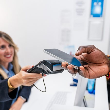 Patient paying for treatment on his phone